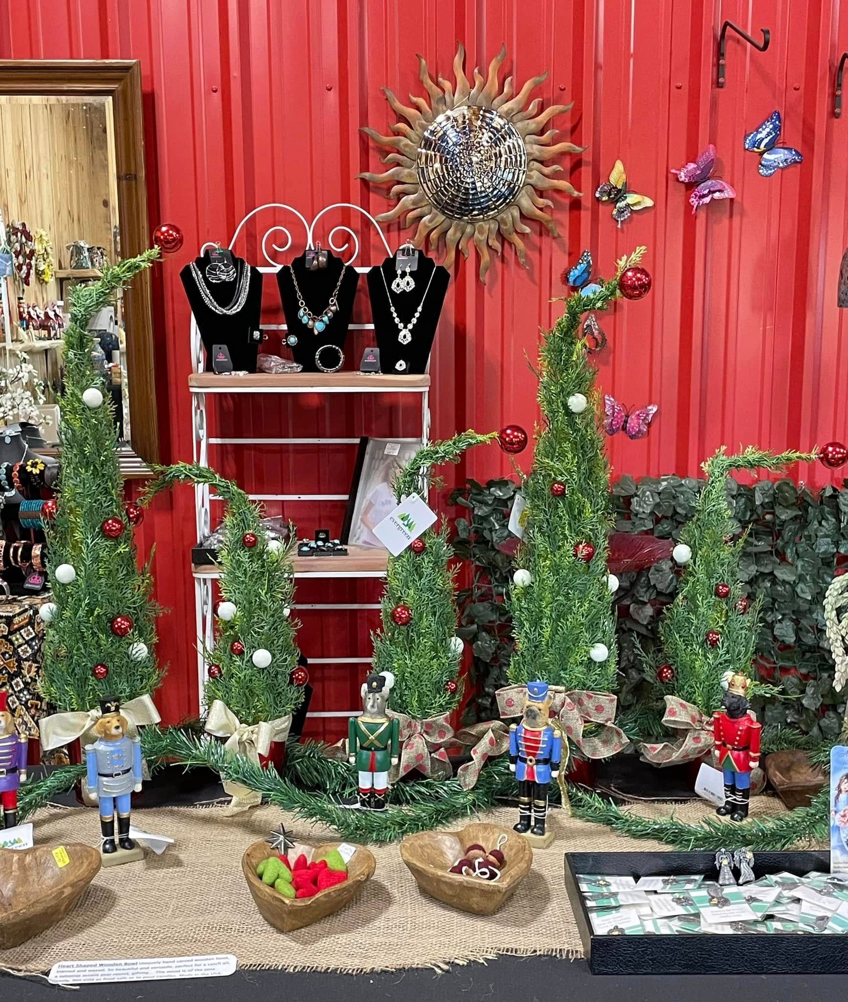 Display of Christmas jewelry and decorations; red background.