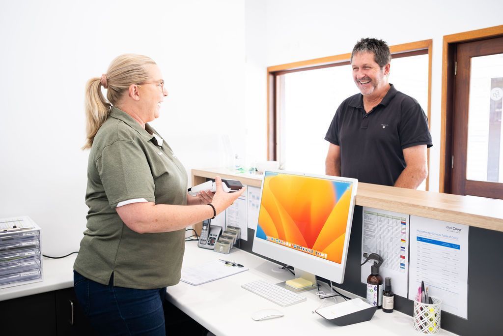male patient checking in to physiotherapy session — Physiotherapist in Kenilworth, QLD