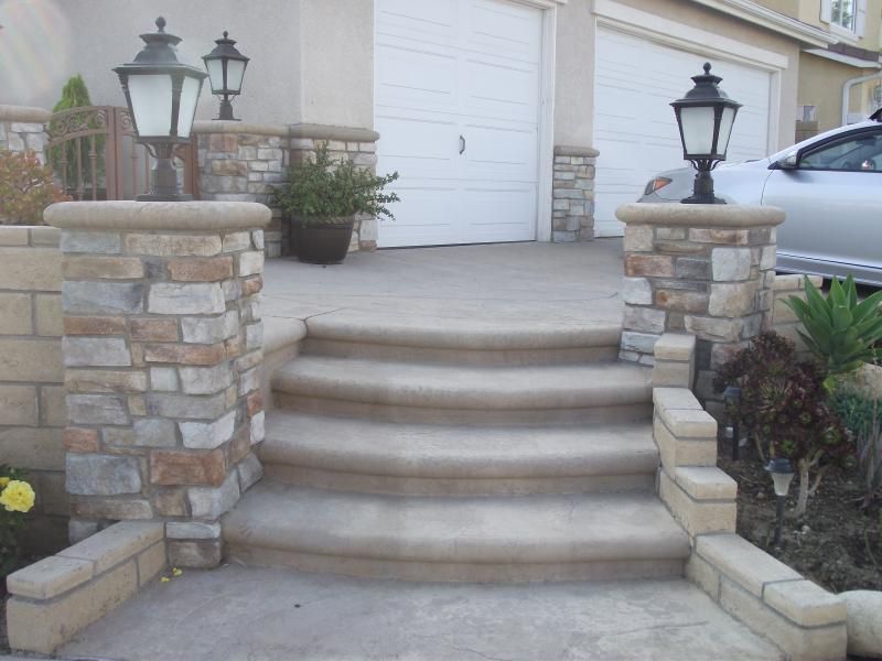 A set of stone steps leading up to a garage