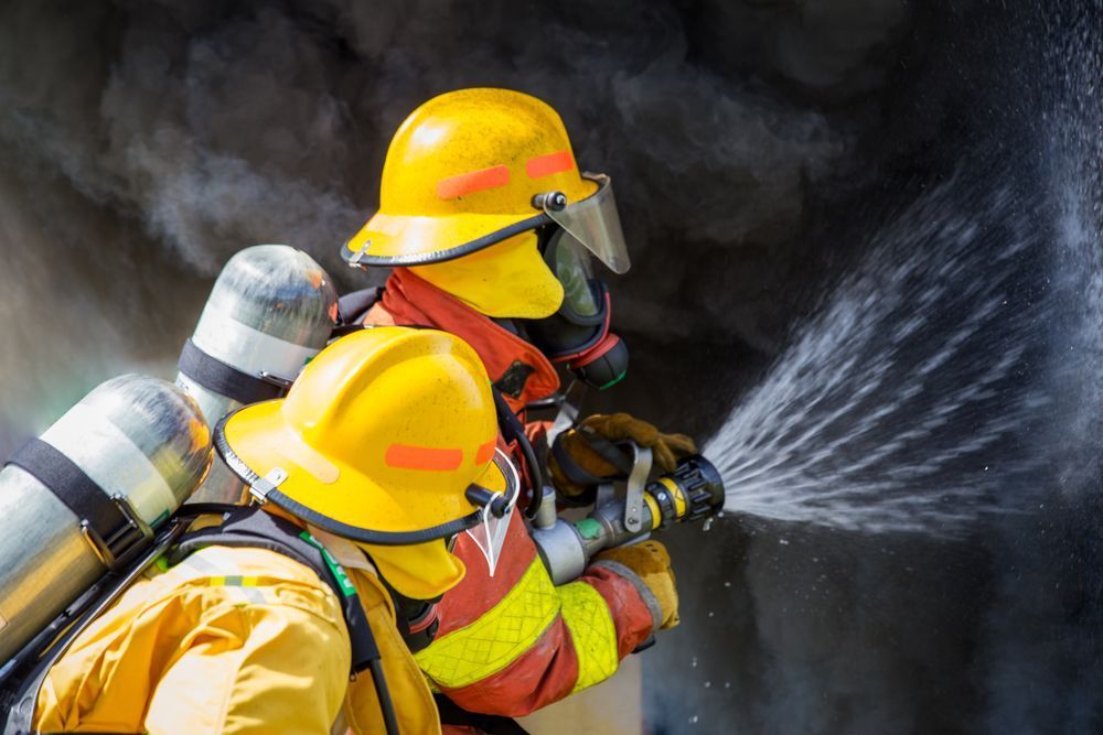 Men Training In Fighting Fire — Fire Safety in Fyshwick, ACT