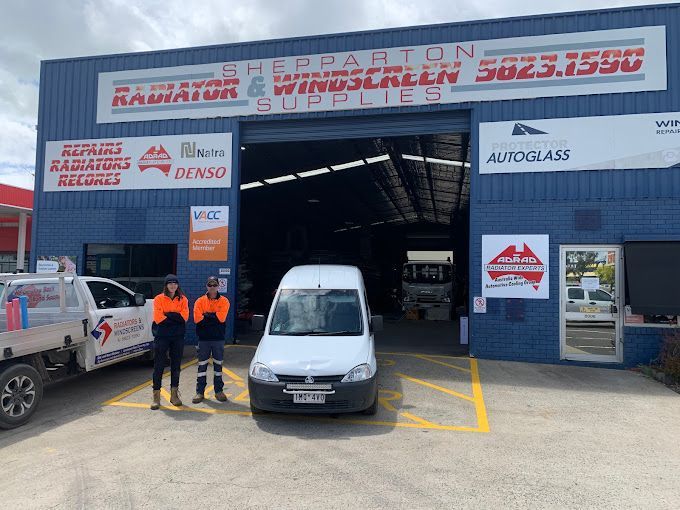 Two Man Standing Beside the Car — Shepparton Radiators & Windscreens in Shepparton, VIC