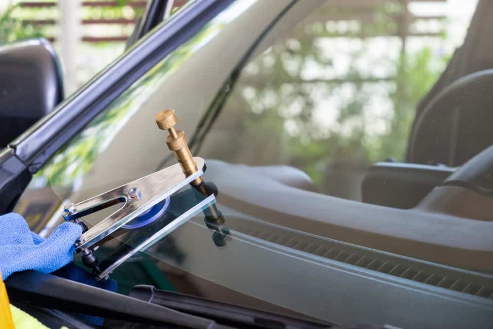 A Person is Repairing a Windshield on a Car — Shepparton Radiators & Windscreens in Yarrawonga, VIC