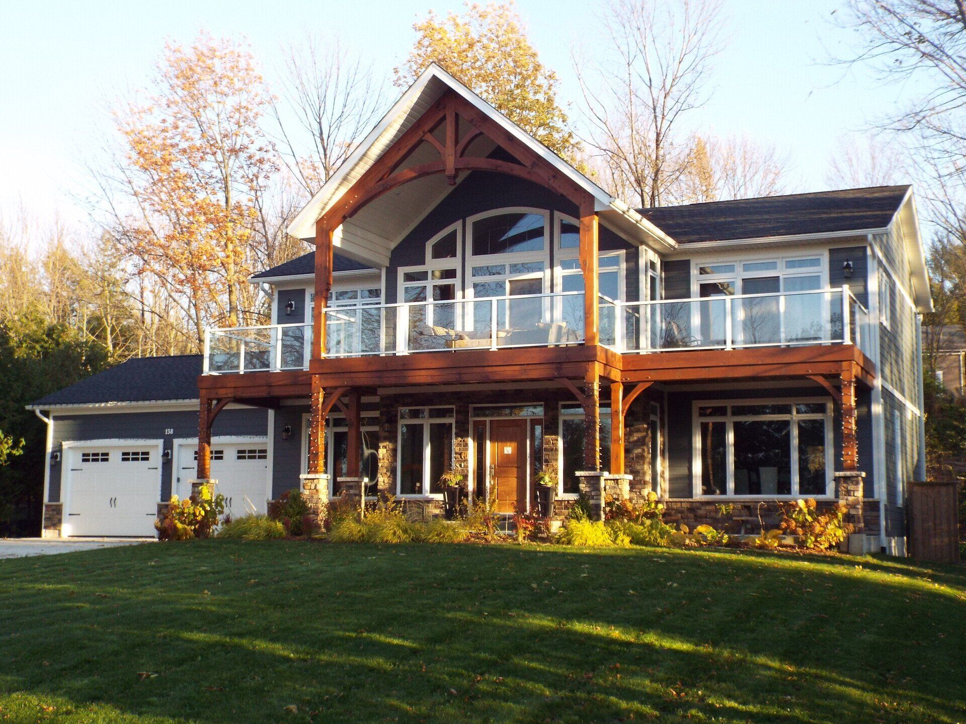A large house with a lot of windows and a large deck