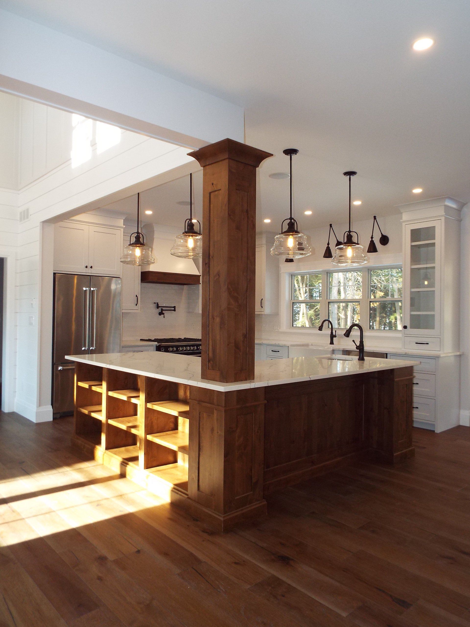 A kitchen with a large island in the middle