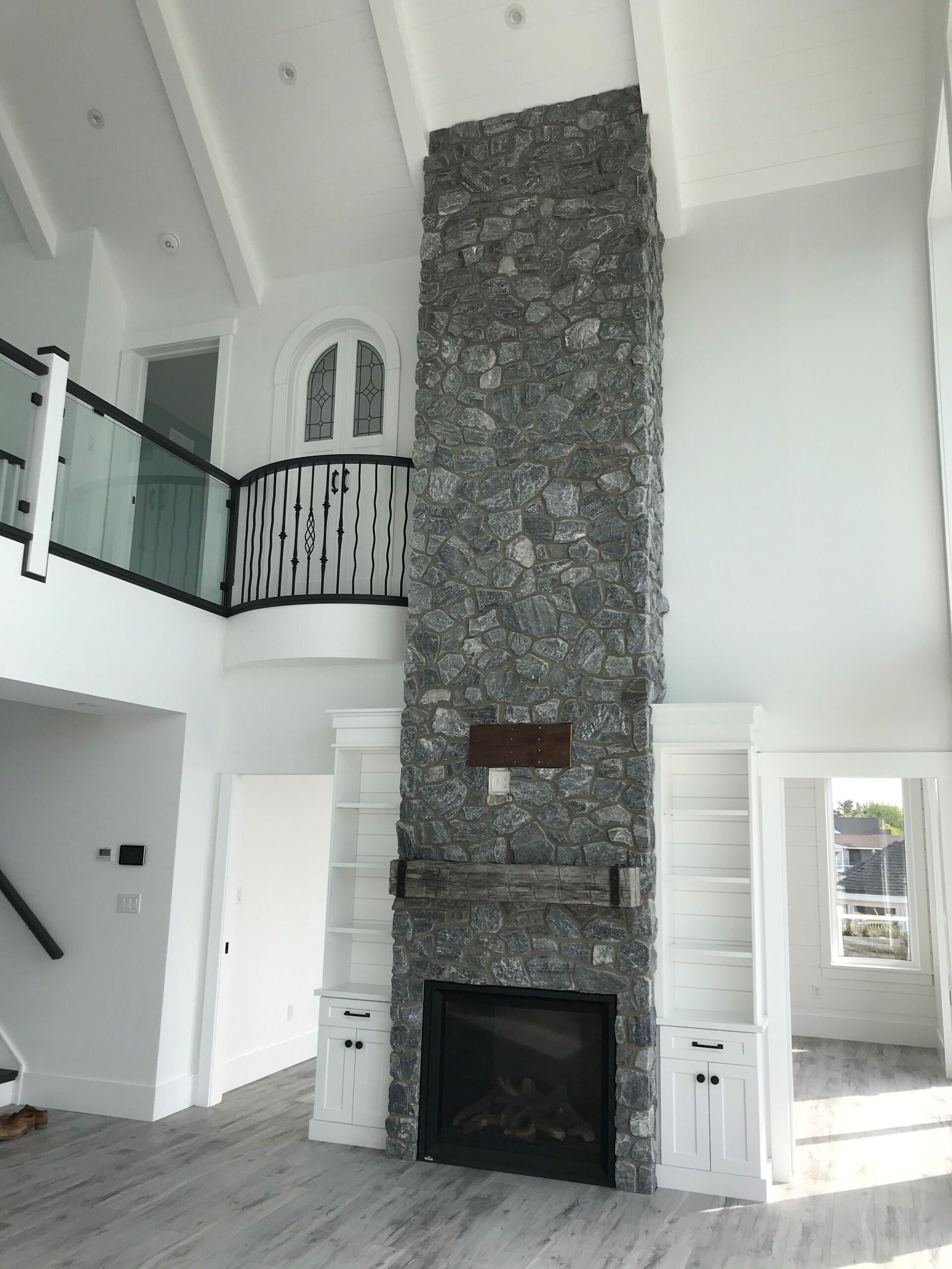 There is a fireplace in the middle of the room.