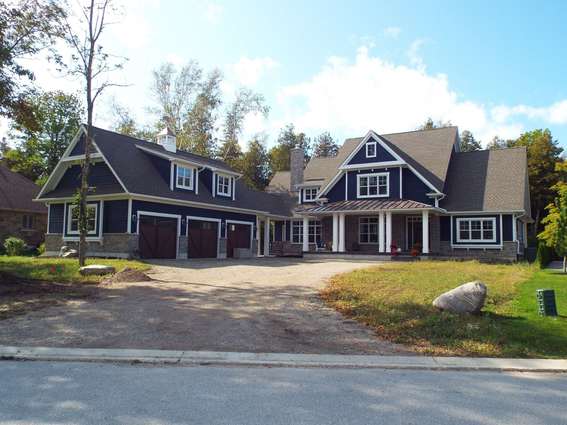 A large house with a driveway leading to it