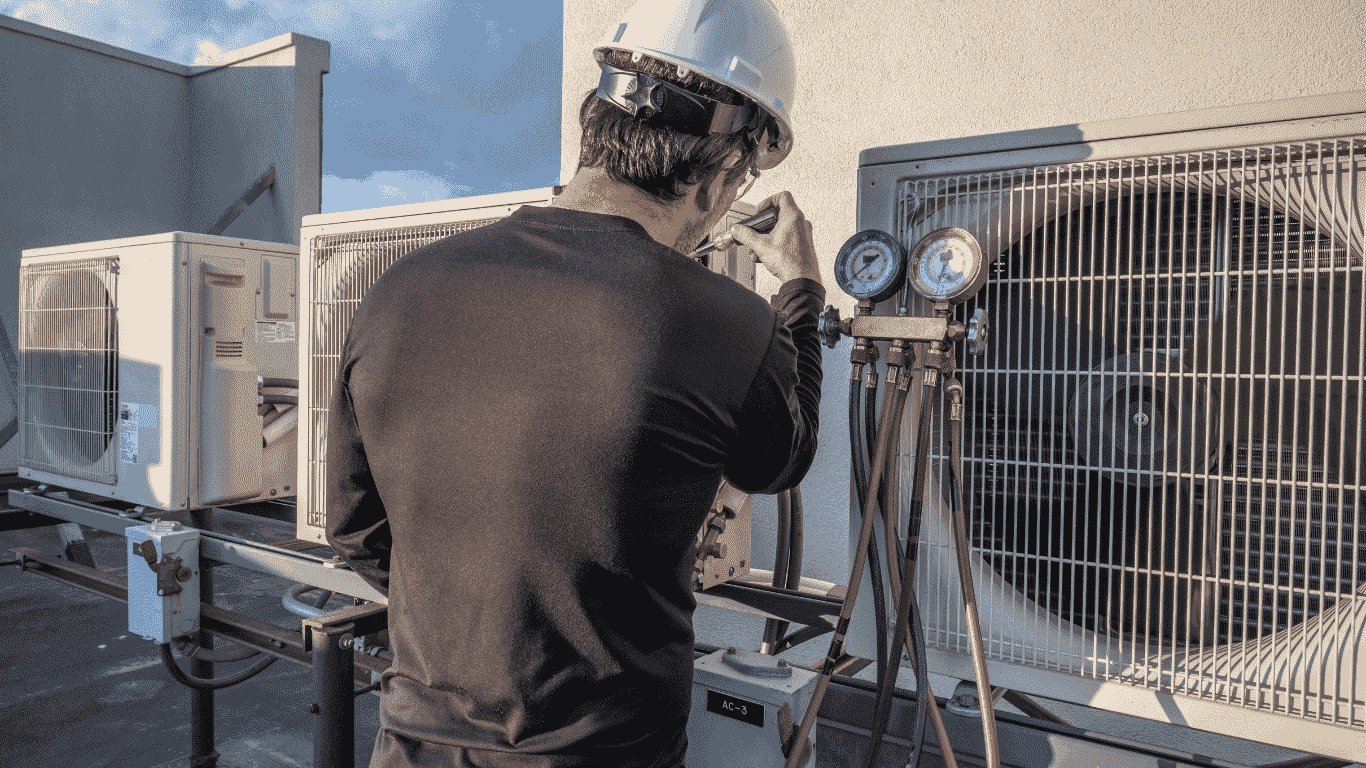 technician working on air conditioning unit