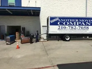 A man loads furniture into a