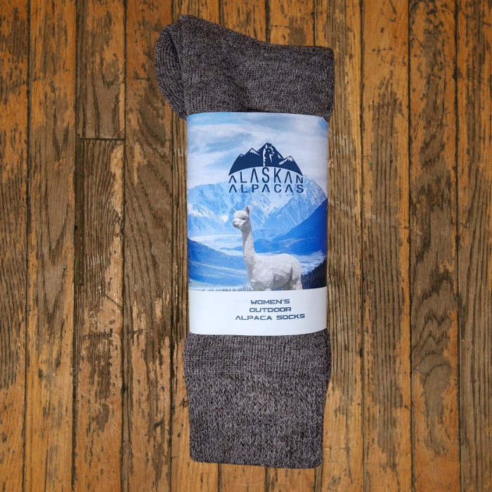 Pair of brown alpaca socks with label, Alaska Alpaca brand.