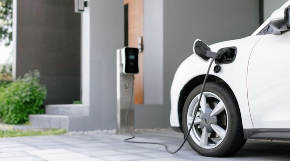 An Electric Vehicle Charger plugged into an Electric Vehicle with installed by GP Electric in Calgary, AB