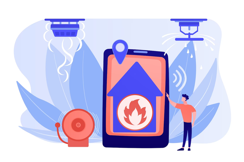 A man is standing next to a smart phone with a fire alarm on it.