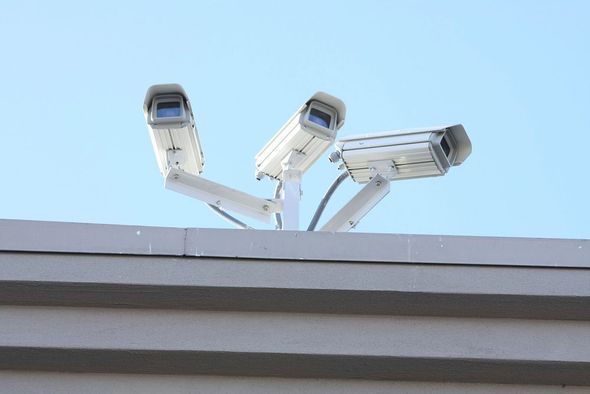 A photo of three security cameras