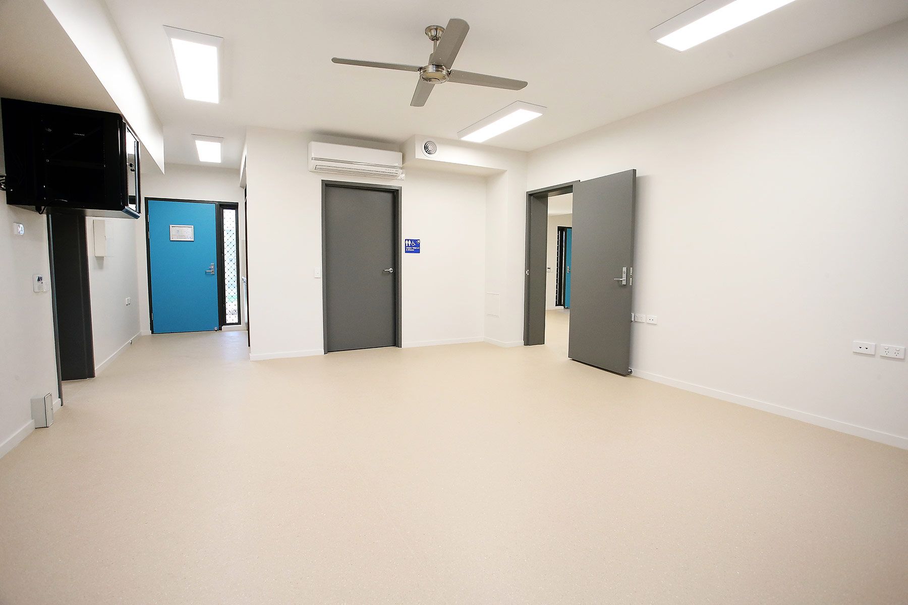 Room With a Ceiling Fan and Air Conditioning — Nick Favot Painting In Bohle, QLD