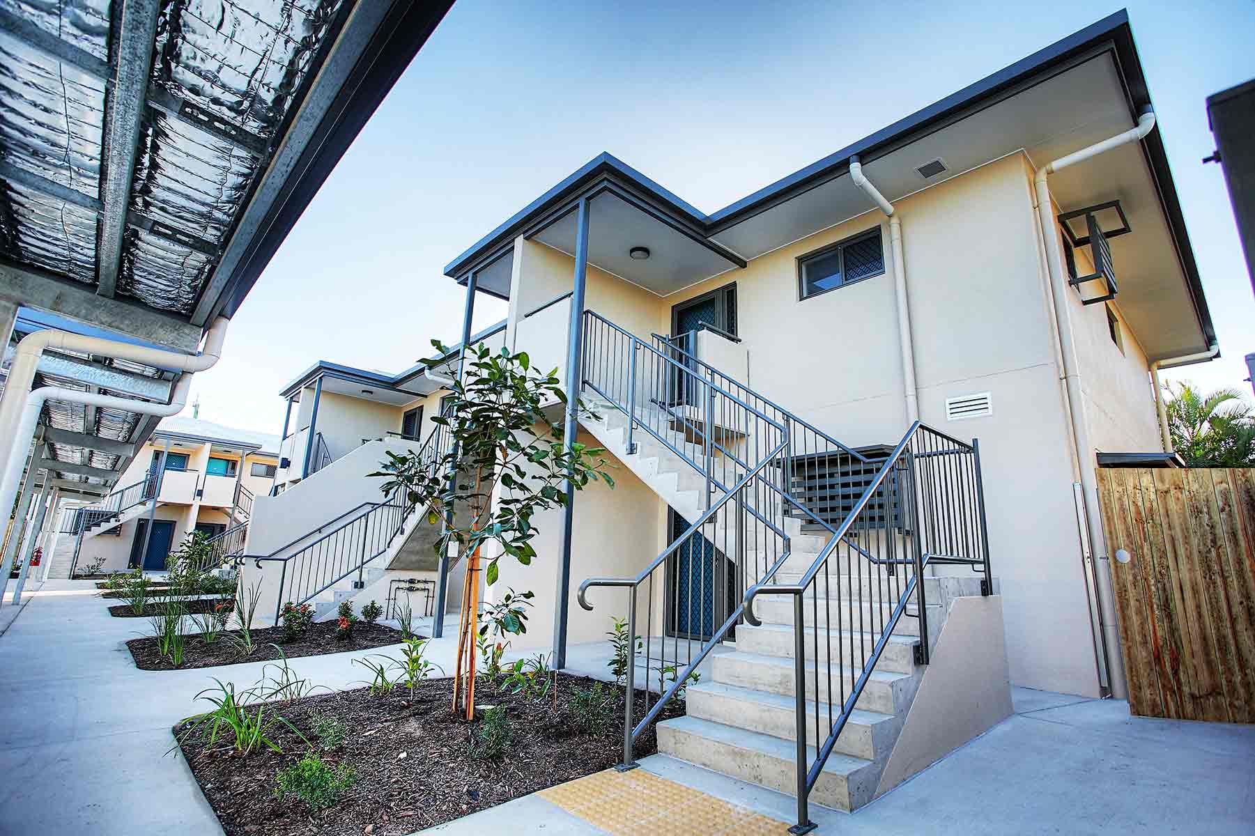 Modern Apartment Complex With Stairs and Metal Railings — Nick Favot Painting In Bohle, QLD
