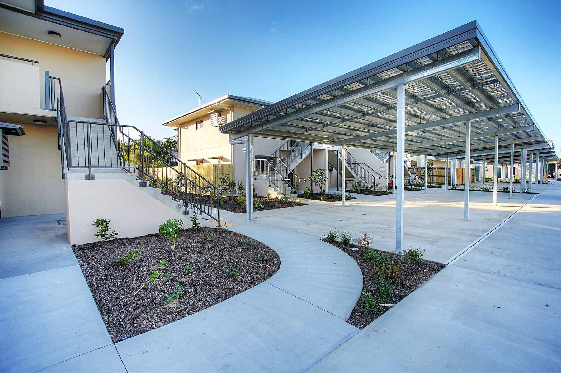 Modern Apartment Complex and a Metal-roofed Parking Area — Nick Favot Painting In Bohle, QLD