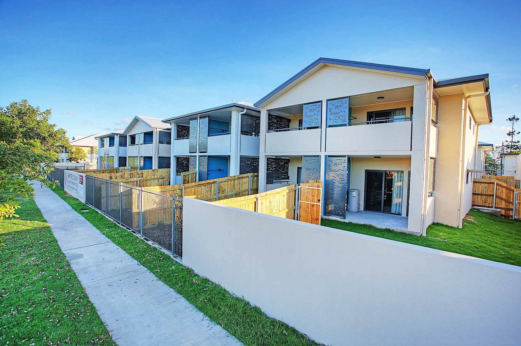 Two-storey Apartment Building With Glass Panels — Nick Favot Painting In Bohle, QLD