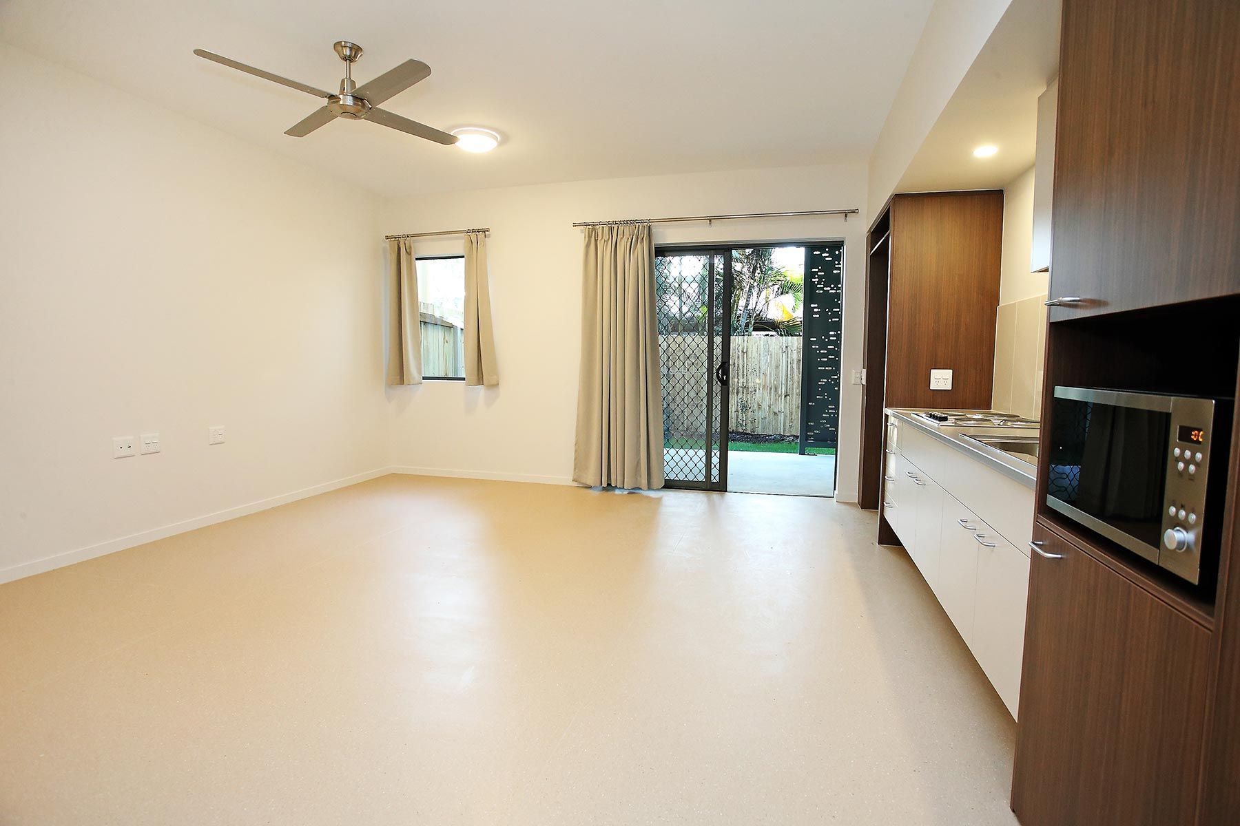 Room With a Ceiling Fan and Sliding Glass Door — Nick Favot Painting In Bohle, QLD