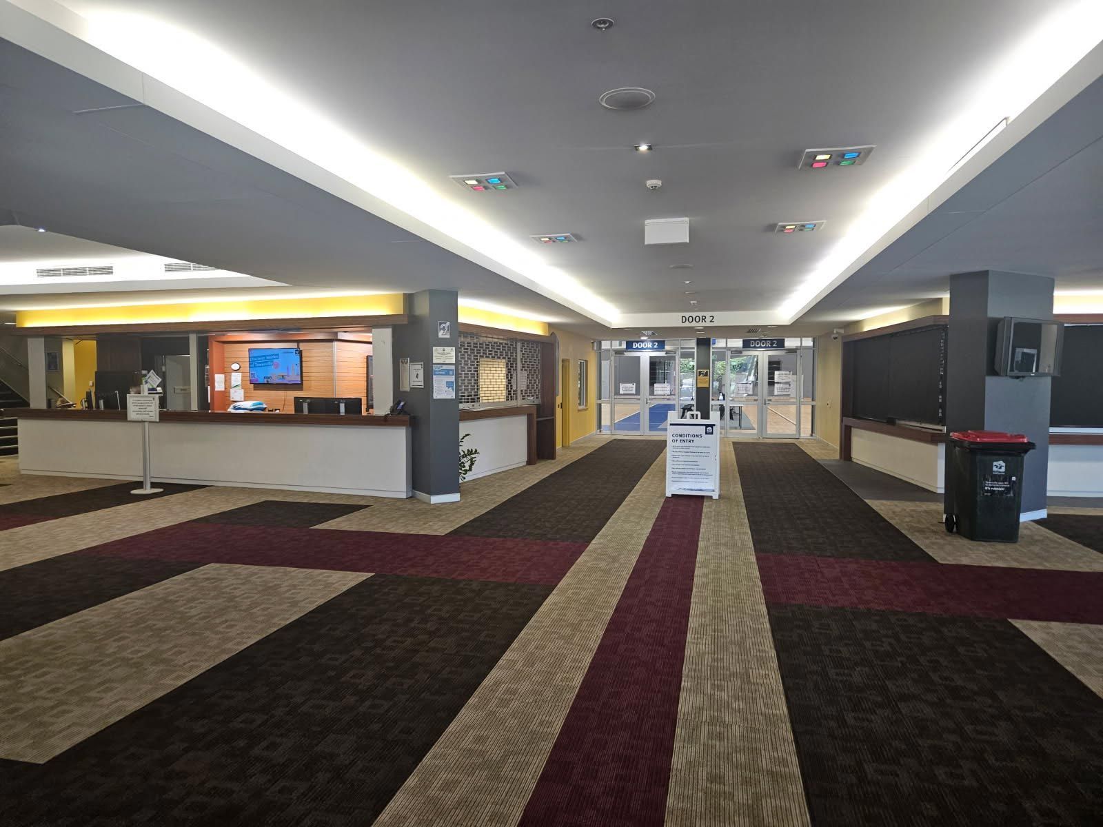 Well-lit Building Lobby With Patterned Carpet — Nick Favot Painting In Bohle, QLD