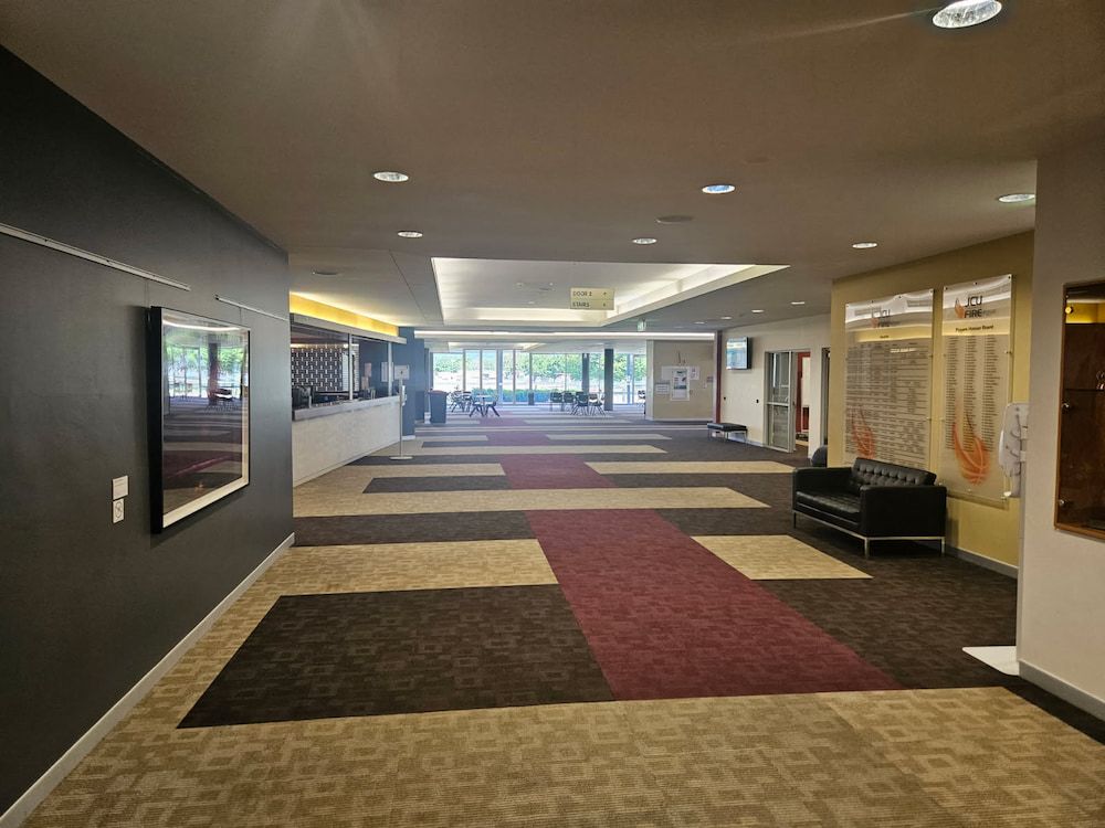 A Long Hallway With a Couch in the Middle of It — Nick Favot Painting in Bohle, QLD