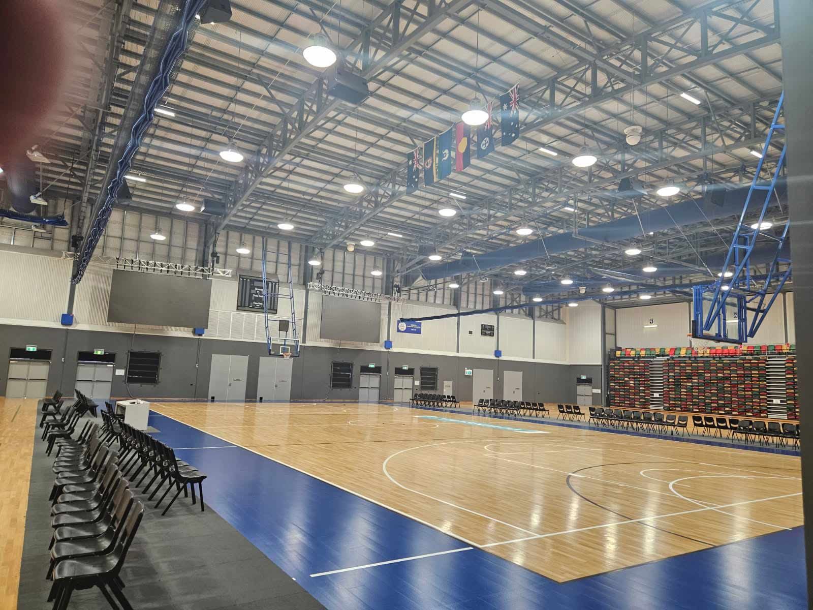 Indoor Basketball Court With Wooden Flooring — Nick Favot Painting In Bohle, QLD