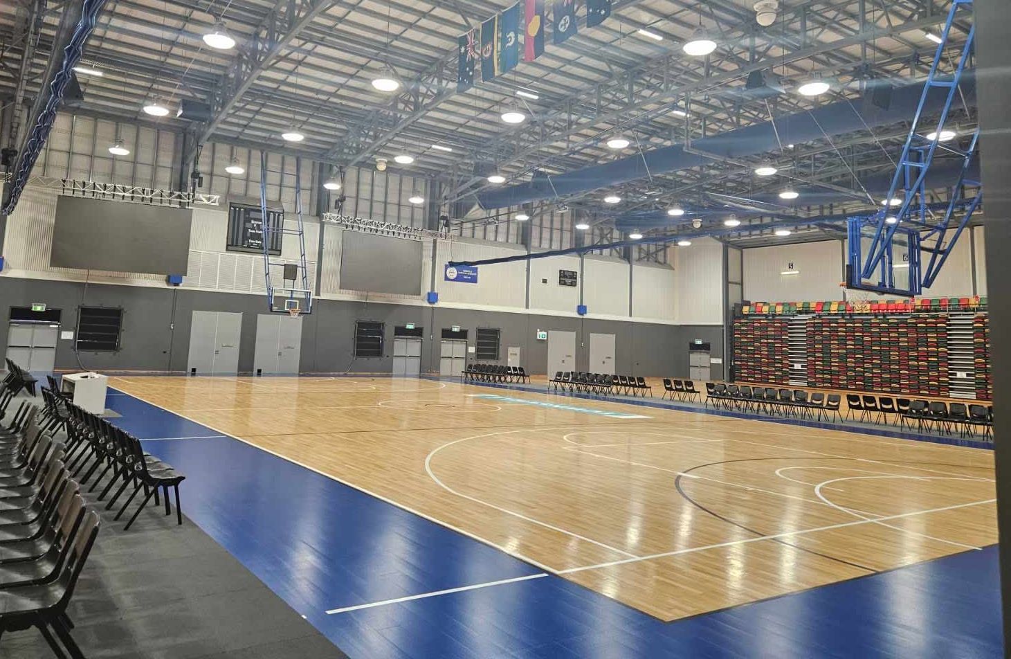 Indoor Basketball Court With Polished Wood Flooring — Nick Favot Painting In Bohle, QLD