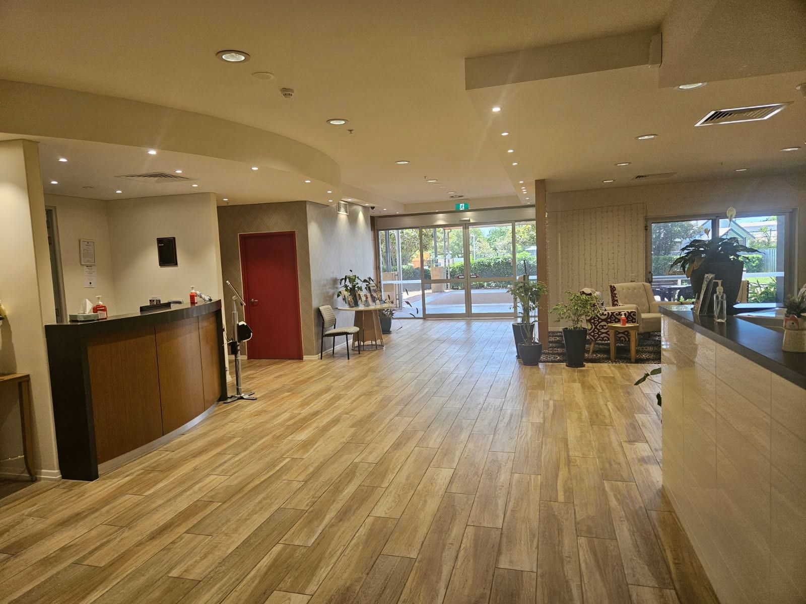 Spacious Reception Area With Wood Flooring — Nick Favot Painting In Bohle, QLD