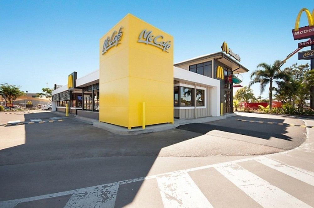 A Mcdonald's Restaurant With a Yellow and White Building — Nick Favot Painting in Bohle, QLD