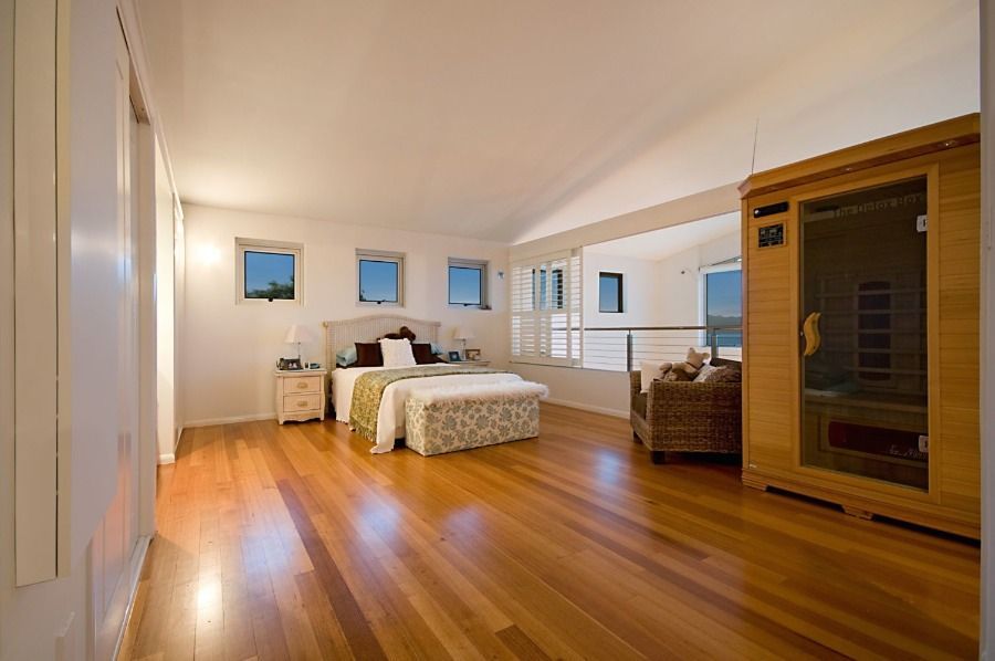 A Bedroom With a Bed and a Sauna in the Corner — Nick Favot Painting in Bohle, QLD