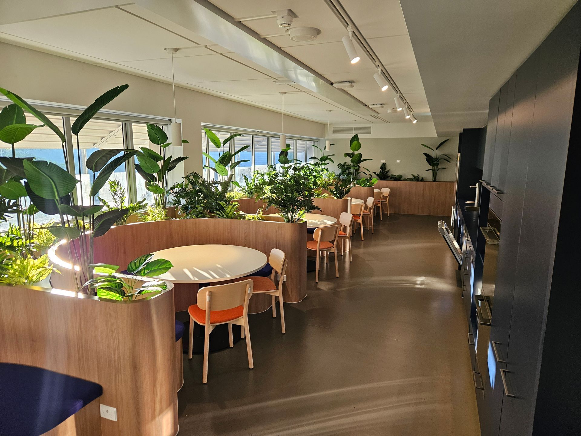 Office Kitchen With Round Tables and Chairs — Nick Favot Painting In Bohle, QLD