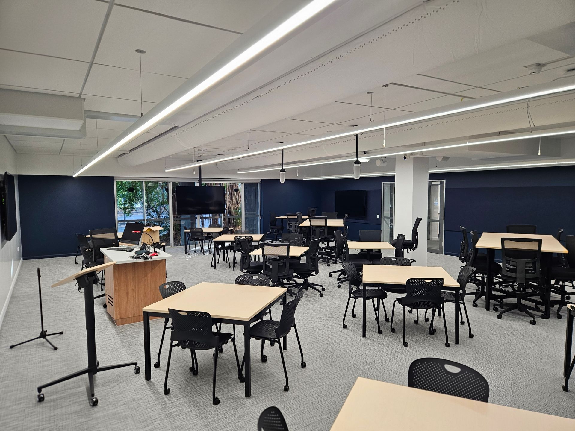 Classroom With Rectangular Tables and Black Chairs — Nick Favot Painting In Bohle, QLD