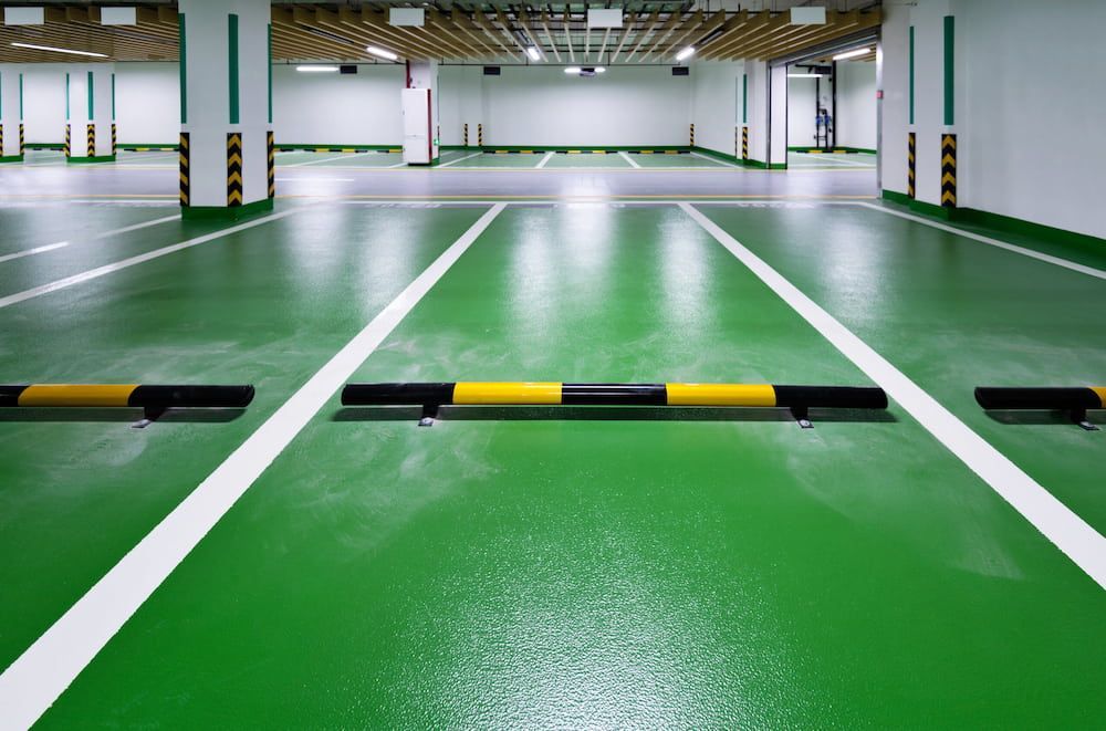 A Parking Garage With Green Floors and White Lines — Nick Favot Painting in Bohle, QLD