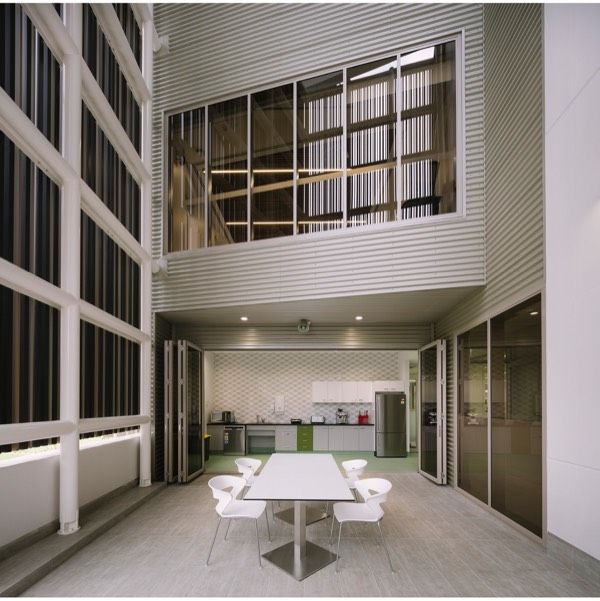 A Large Room With a Table and Chairs in It — Nick Favot Painting in Bohle, QLD