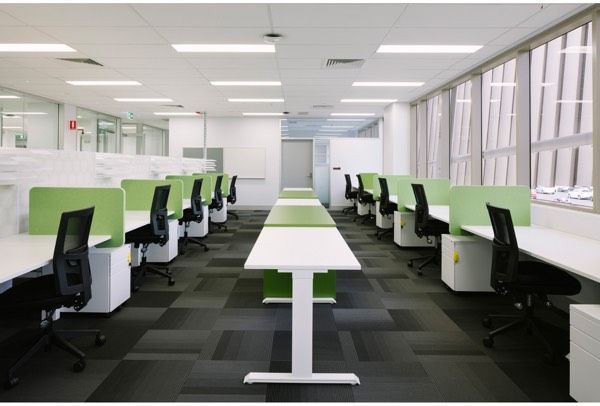A Long Row of Desks and Chairs in an Office — Nick Favot Painting in Bohle, QLD