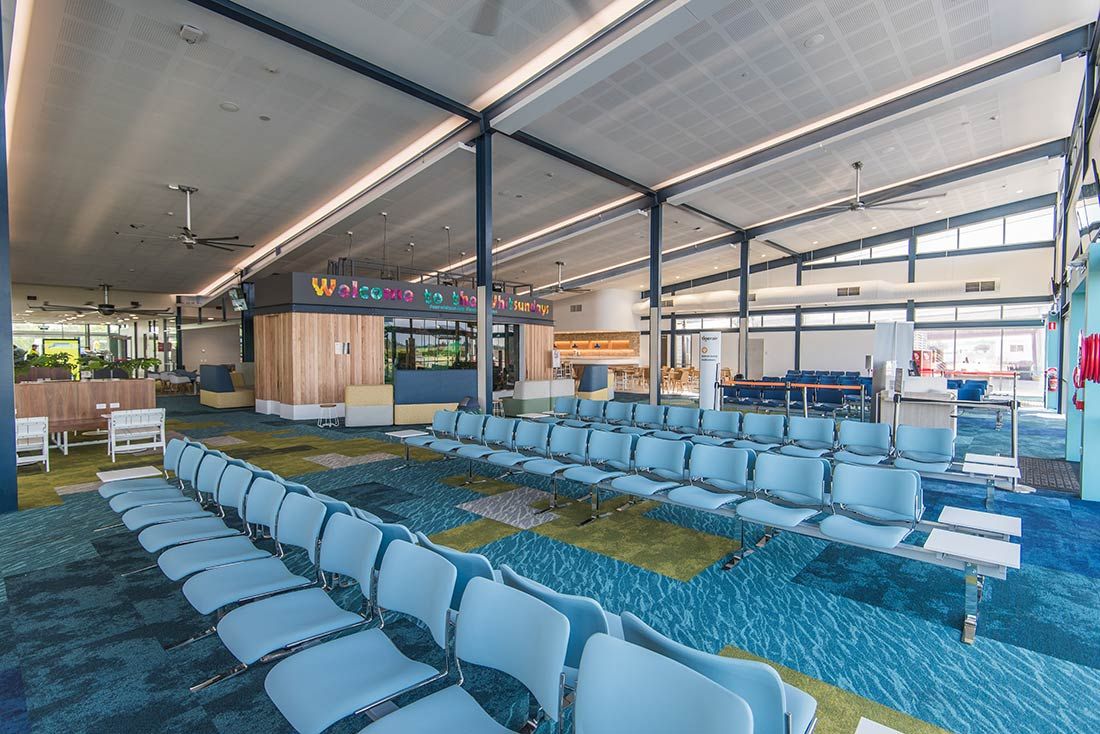 A Long Row of Chairs in a Waiting Room at an Airport — Nick Favot Painting in Bohle, QLD