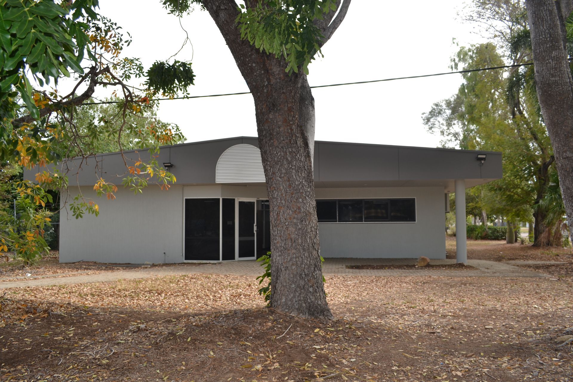 A Grey Building With Large Windows — Nick Favot Painting In Bohle, QLD