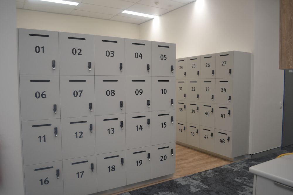 A Room Filled With White Lockers With Numbers on Them — Nick Favot Painting in Bohle, QLD
