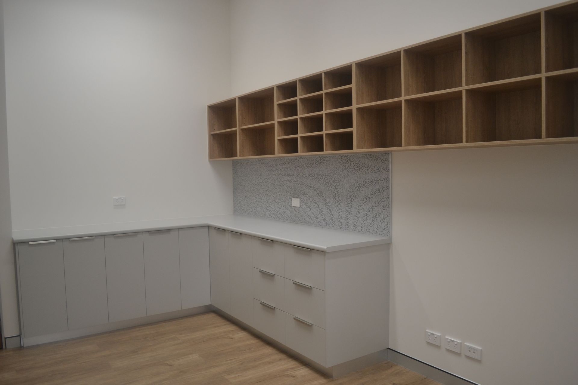 Modern Kitchen With Grey Lower Cabinets and Wooden Open Shelves Above — Nick Favot Painting In Bohle, QLD