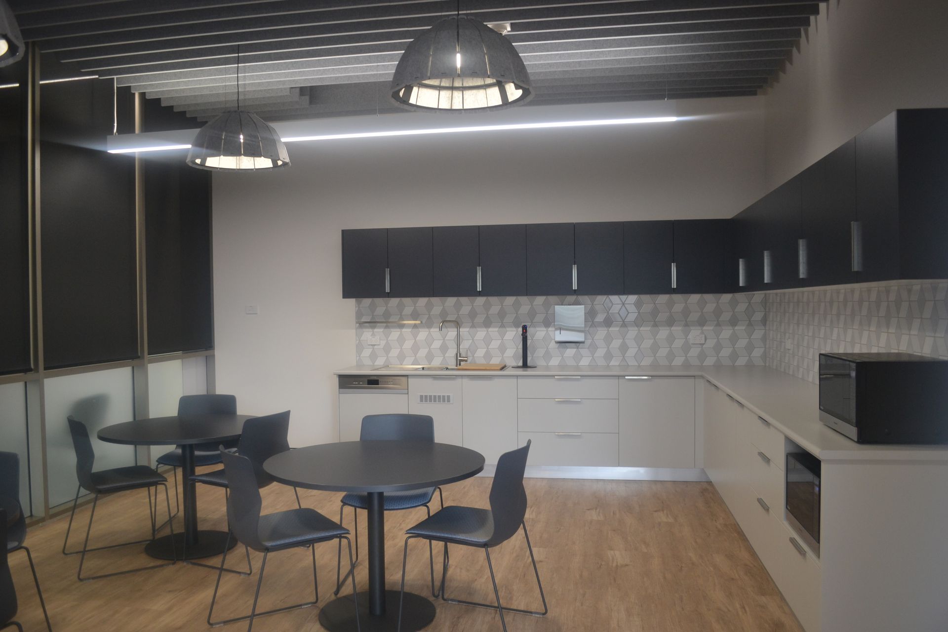 Black Tables and Chairs on Wood Flooring — Nick Favot Painting In Bohle, QLD