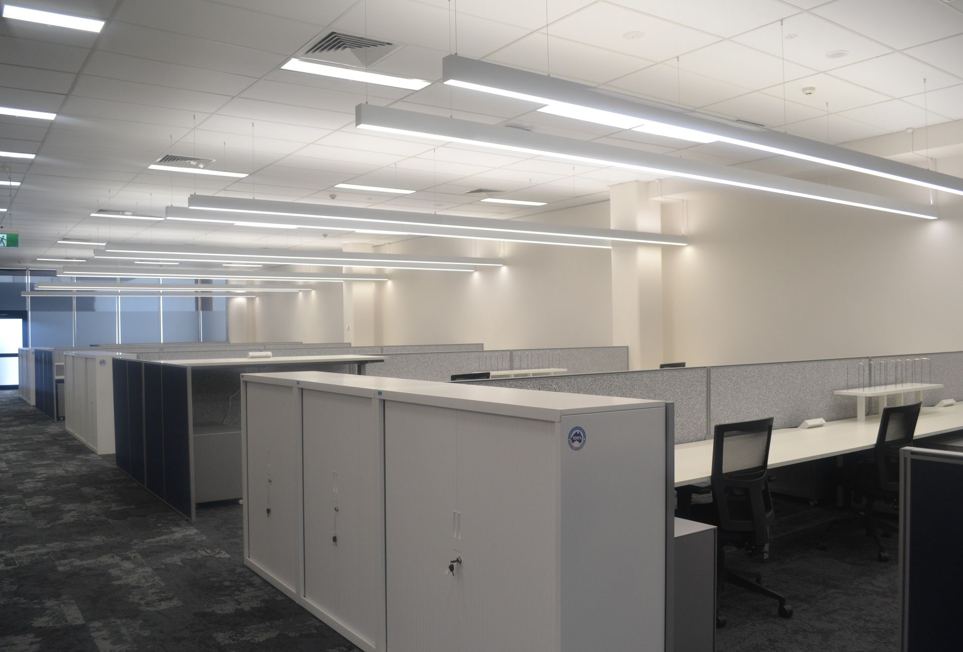 Modern Office Interior With Rows of Empty White Cubicles — Nick Favot Painting In Bohle, QLD