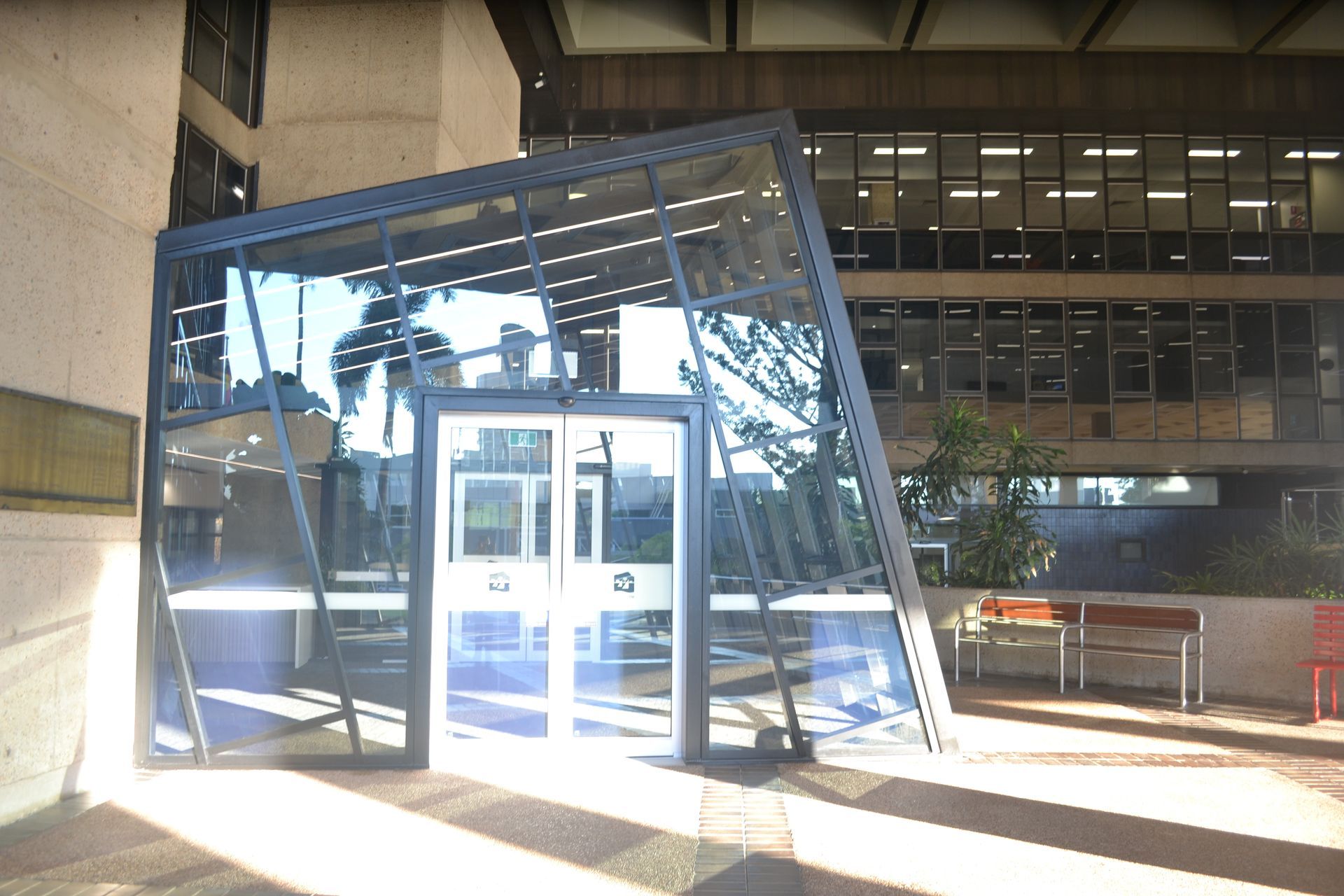 Tilted Glass Entrance Structure Reflecting Sunlight — Nick Favot Painting In Bohle, QLD
