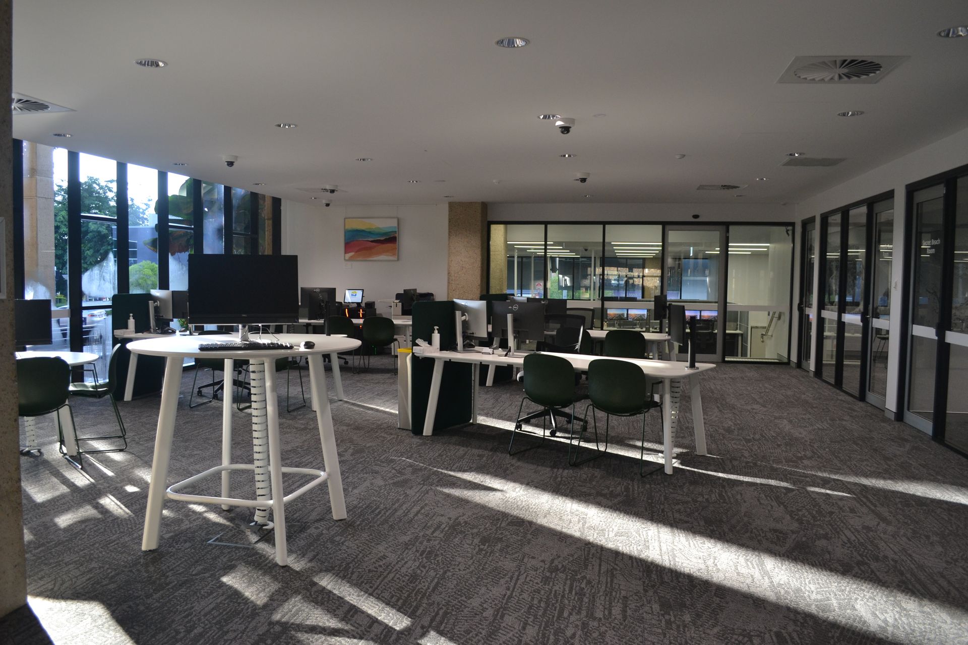 Modern Office Space With Large Windows and Grey Carpet — Nick Favot Painting In Bohle, QLD