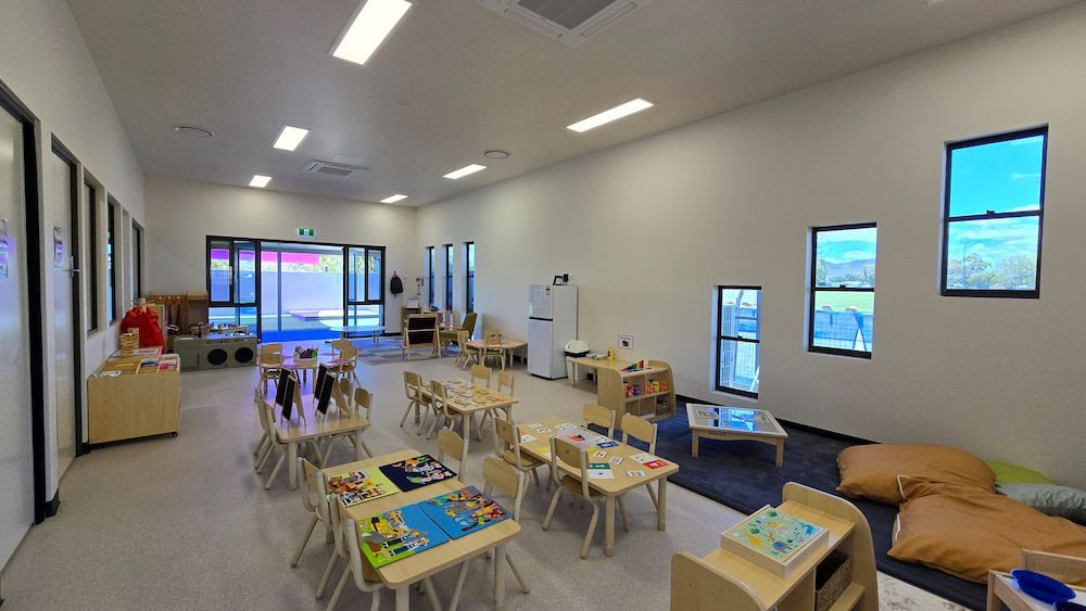 A Large Room With Tables and Chairs in It — Nick Favot Painting in Bohle, QLD
