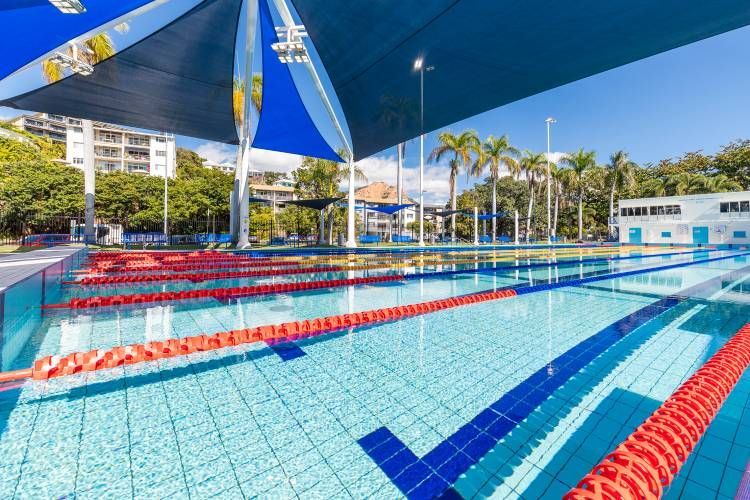 A Large Swimming Pool With a Lot of Lanes and a Canopy Over It — Nick Favot Painting in Bohle, QLD