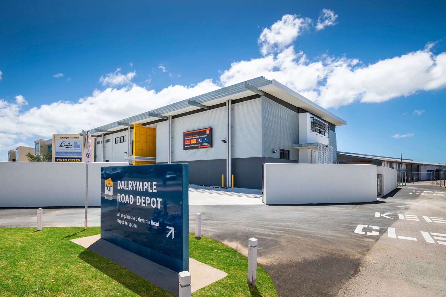 Modern Industrial Building Under a Bright Blue Sky — Nick Favot Painting In Bohle, QLD