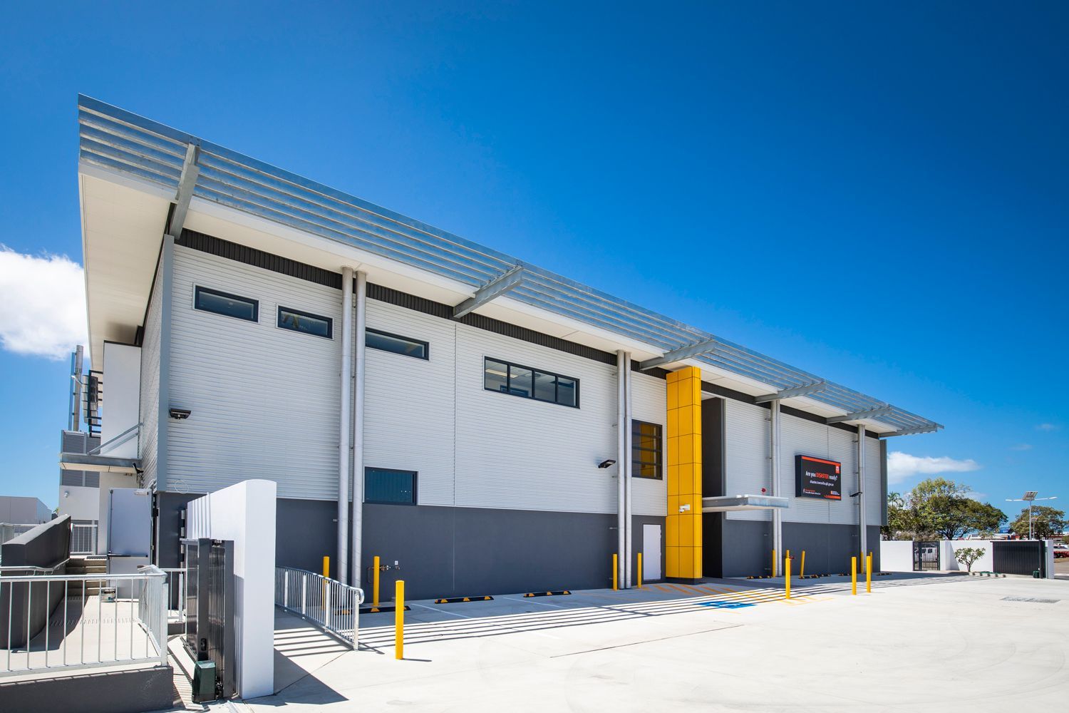 Industrial Building With a White Facade — Nick Favot Painting In Bohle, QLD