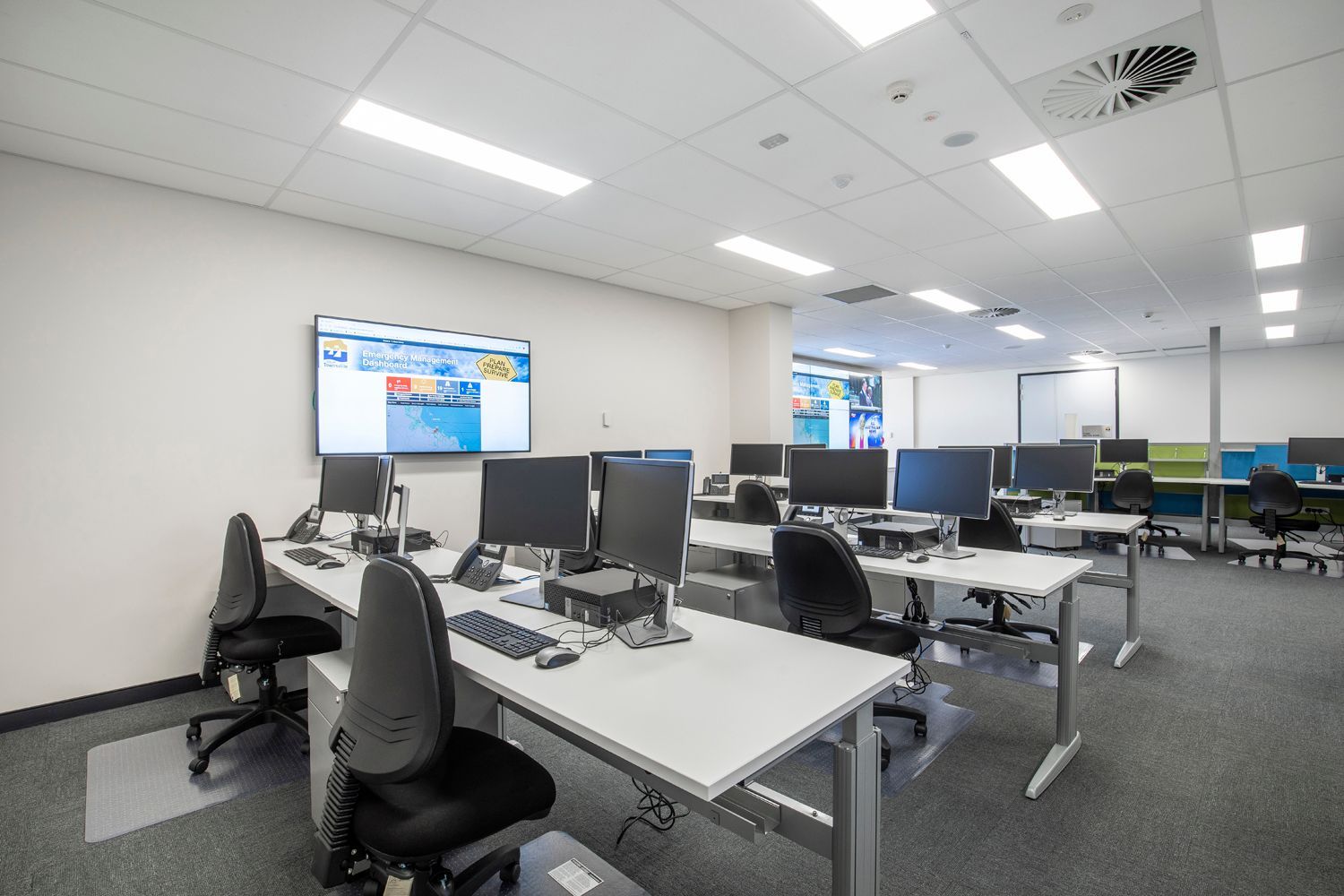 Modern Office With Rows of Desks, Each With a Computer — Nick Favot Painting In Bohle, QLD