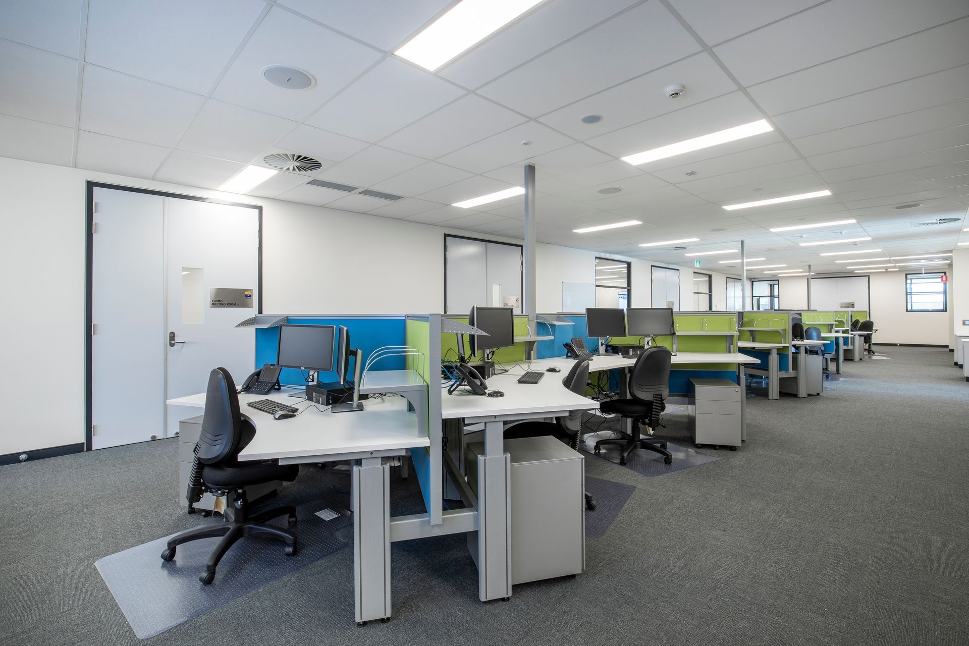 Modern Office With Green and Blue Cubicle Dividers — Nick Favot Painting In Bohle, QLD