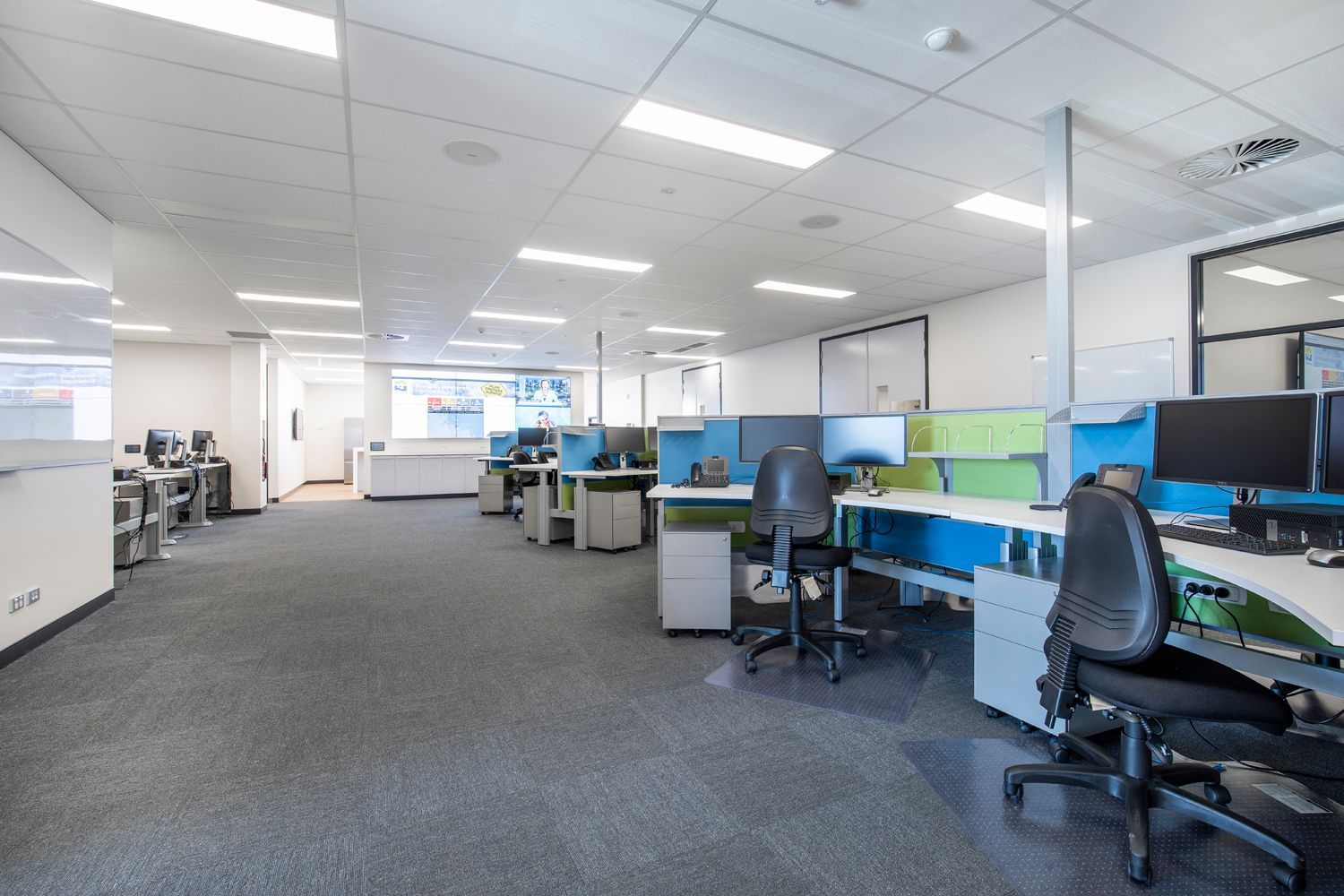 Office With Rows of Blue and Green Partitioned Desks — Nick Favot Painting In Bohle, QLD
