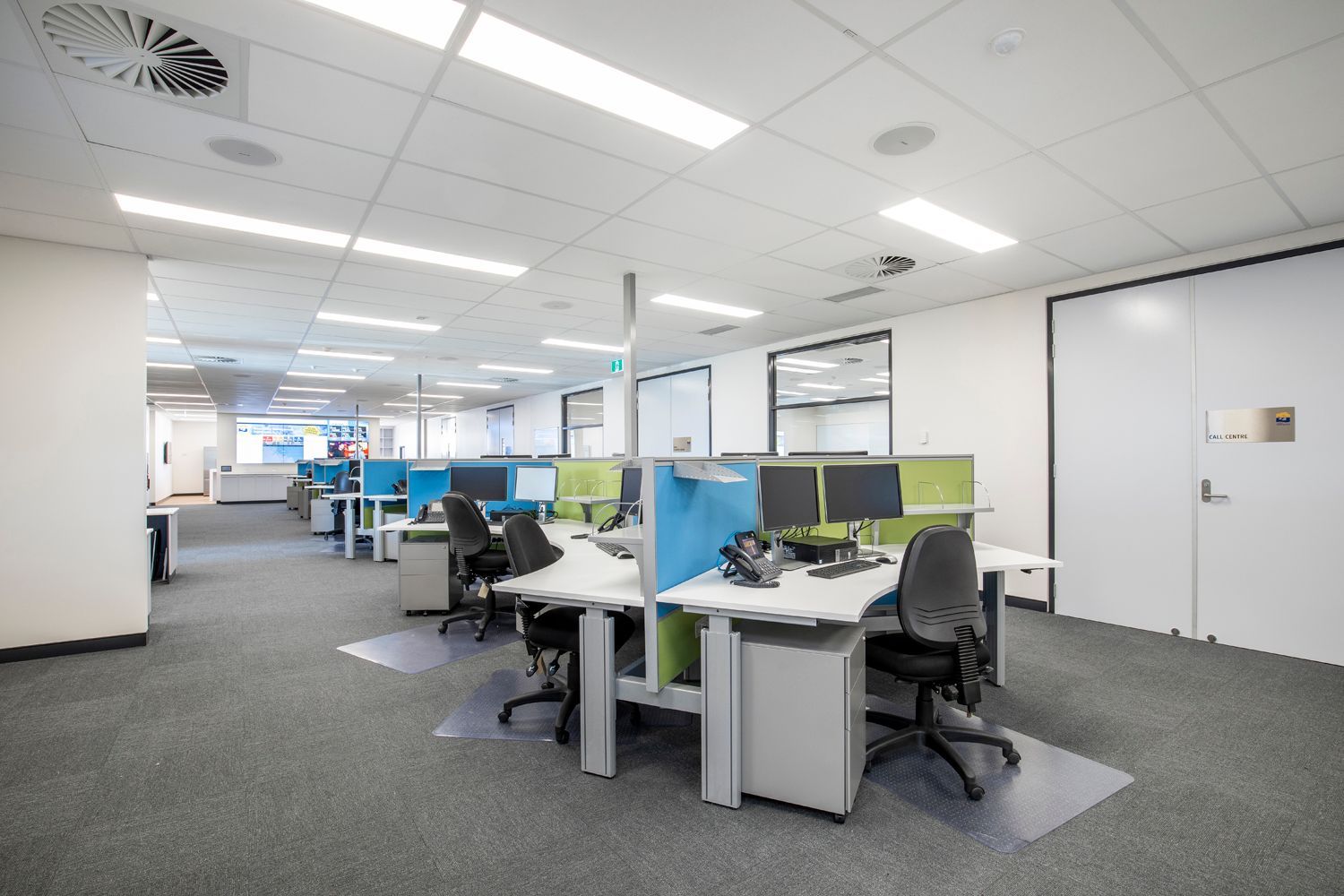 Office With Rows of Empty Workstations Featuring Computers and Chairs — Nick Favot Painting In Bohle, QLD