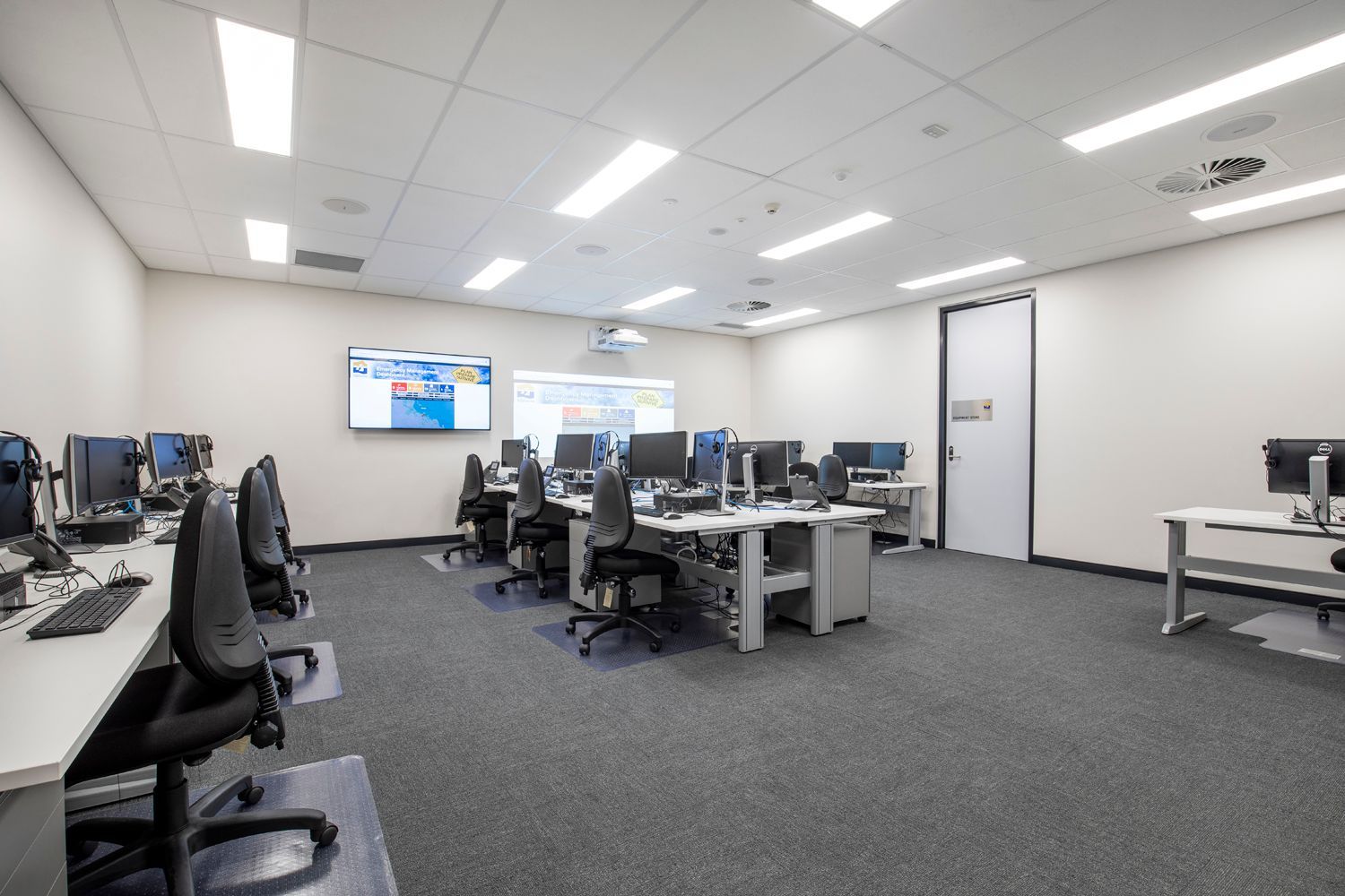 Modern Computer Lab With Desktop Monitors on White Desks — Nick Favot Painting In Bohle, QLD